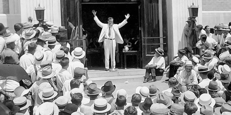 Gov. Huey Long campaigns in Arkansas for Hattie Caraway, the first woman elected to the U.S. Senate.