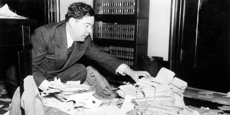 Sen. Huey Long with some of the 60,000 pieces of mail he received weekly at his U.S. Senate office.