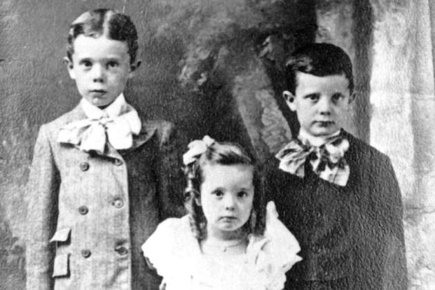 Huey Long as a child (left), with brother Earl and sister Lucille.