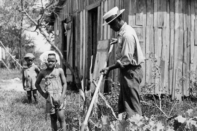 Box factory worker living in poverty as a result of low wages (1938). The average wage was about one dollar a day for the average Louisiana factory worker.