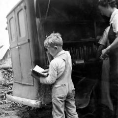 A child from Winn Parish, La., visits the bookmobile in 1938. Books were rare in rural parishes until Huey Long's statewide initiatives to educate the rural poor.