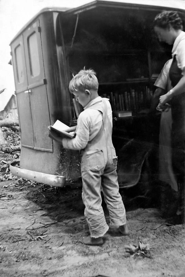 <strong>A child from Winn Parish, La., visits the bookmobile in 1938</strong>.