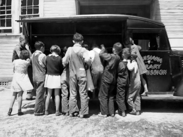 Children visit the Bookmobile. Books were rare in rural parishes until Huey Long's statewide initiatives to educate the rural poor.