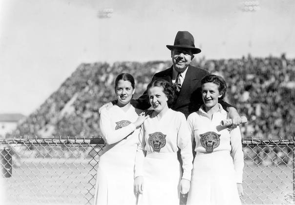 Huey Long with cheerleaders at a Louisiana State University football game.
