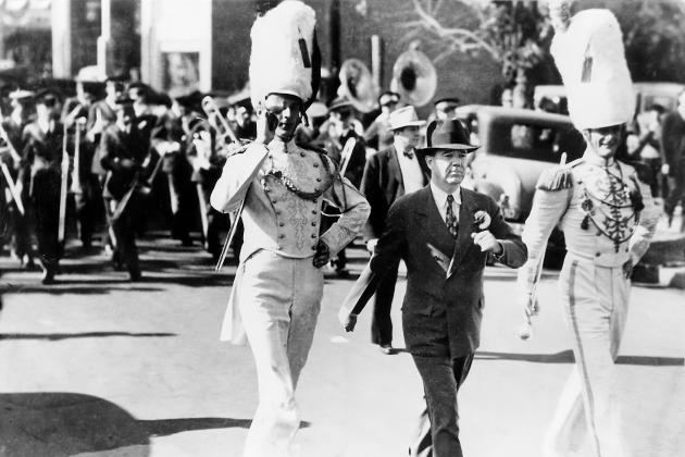 Huey Long marches with the Louisiana State University band. Long's first step to generate excitement for LSU was to quadruple the size of the marching band.