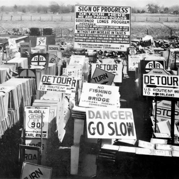 Signs of progress: road signs for Huey Long's massive road construction program